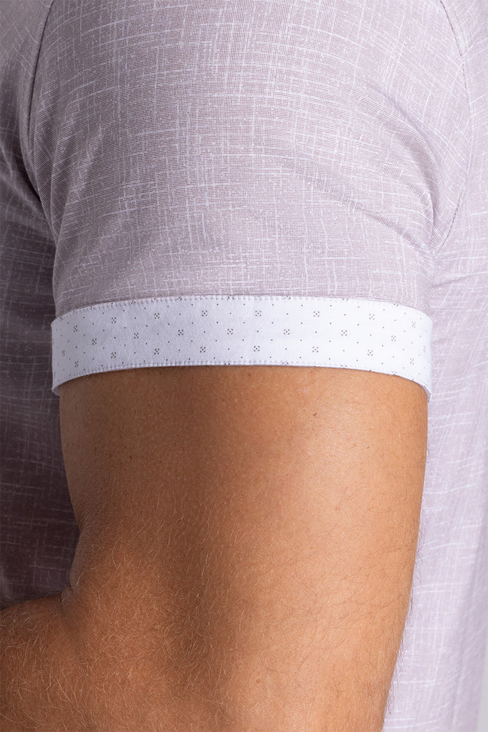 Model wearing Encore Sand short sleeve classic collar shirt, style with white shorts
