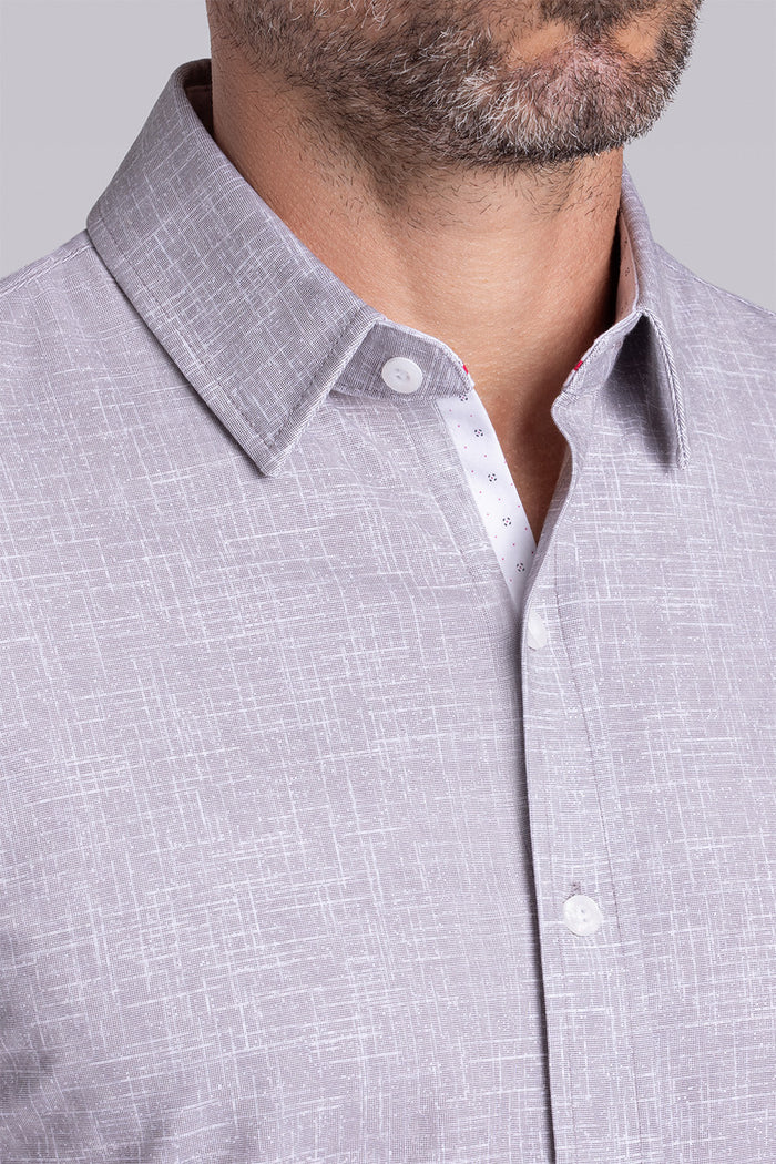 Model wearing Encore Taupe short sleeve classic collar shirt, style with white shorts