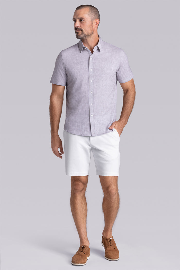 Model wearing Encore Taupe short sleeve classic collar shirt, style with white shorts