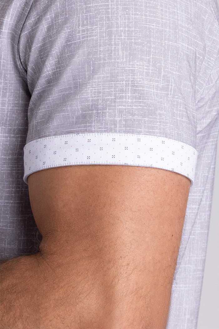 Model wearing Encore Taupe short sleeve classic collar shirt, style with white shorts