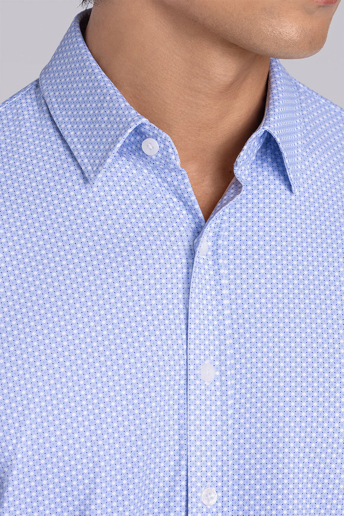 Model wearing the Ethereal Blue long sleeve dress shirt, styled with fitted black dress slacks.