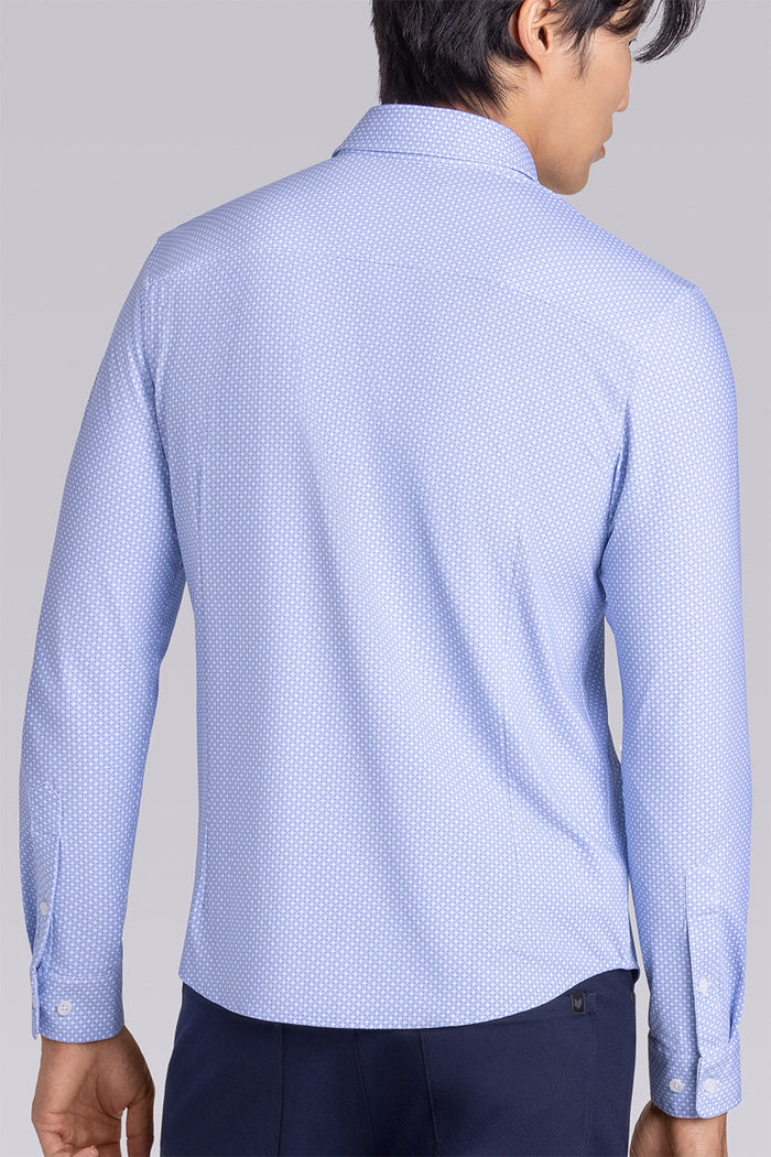 Model wearing the Ethereal Blue long sleeve dress shirt, styled with fitted black dress slacks.