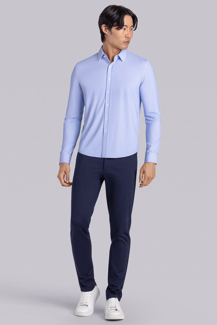 Model wearing the Ethereal Blue long sleeve dress shirt, styled with fitted black dress slacks.
