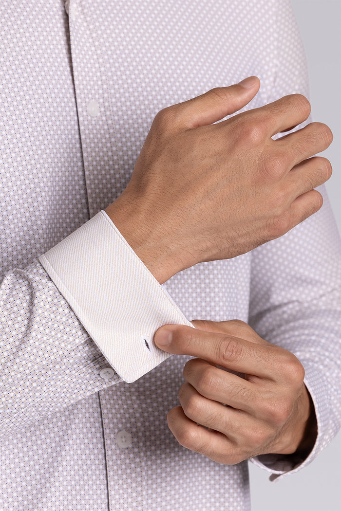 Model wearing the Elusive Sand long sleeve dress shirt, styled with fitted black dress slacks.