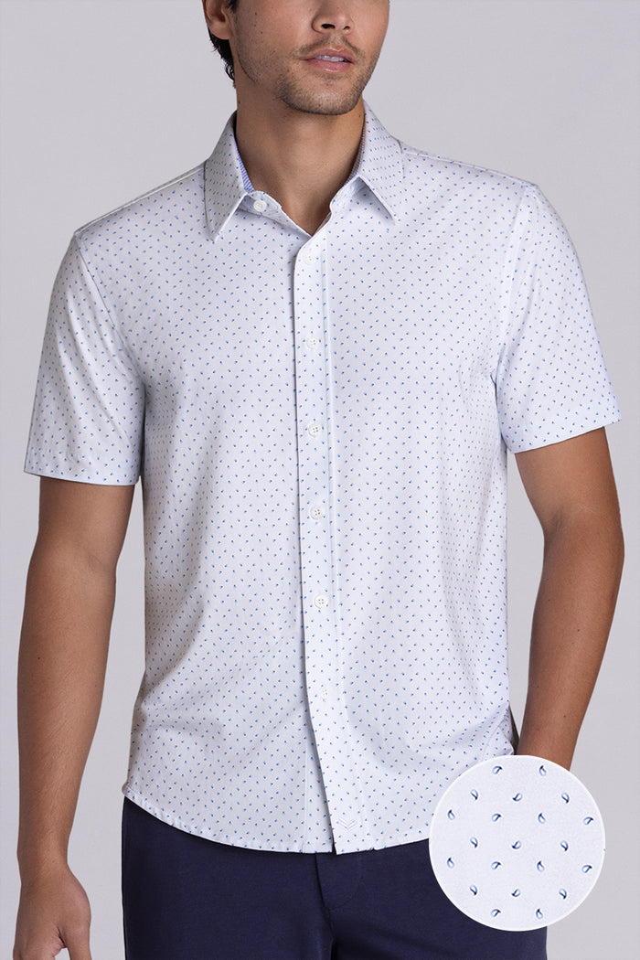 Model wearing Exhilarate White short sleeve shirt, styled with black shorts