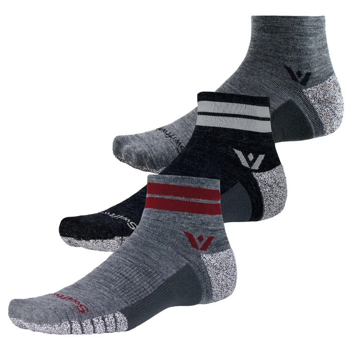 Three low-cut SWIFTWICK performance socks in gray, black, and maroon with striped cuffs and logo.
