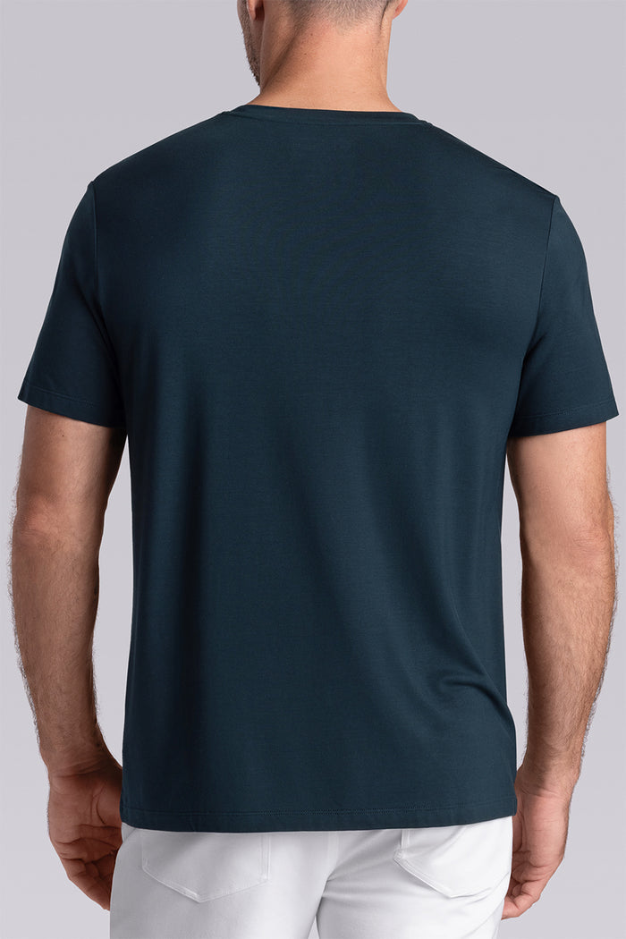 Model wearing Fundamental Black Charcoal Icy Bamboo® short sleeve crewneck, styled with white pants.