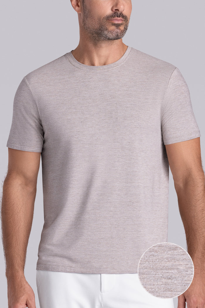 Model wearing the Fundamental Oak Tree Heather Icy Bamboo® short sleeve crewneck, styled with white shorts.