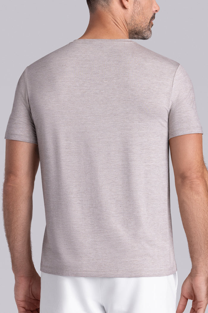 Model wearing the Fundamental Oak Tree Heather Icy Bamboo® short sleeve crewneck, styled with white shorts.