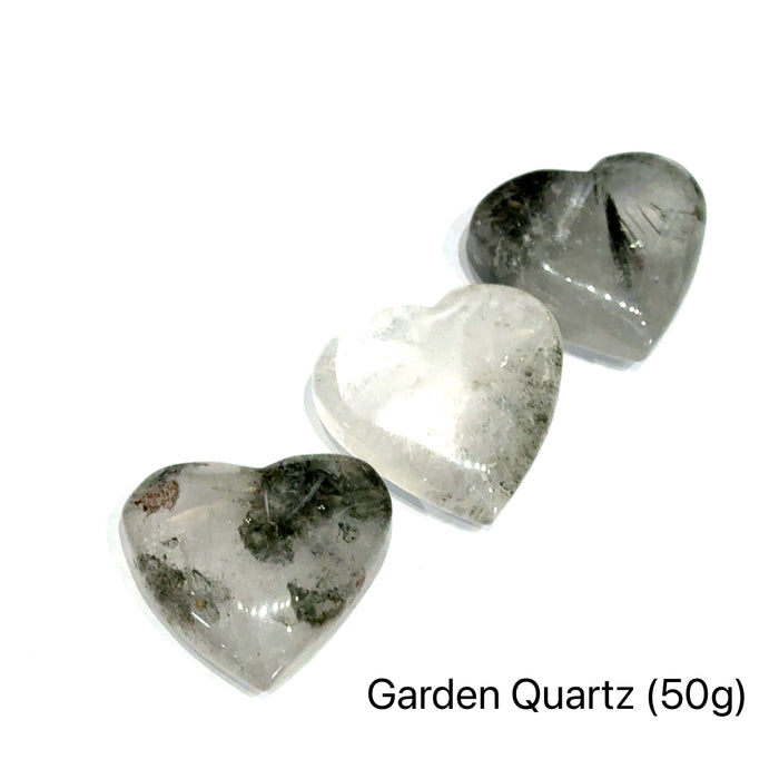 Garden Quartz Heart Carving on white grouping of 50g overview