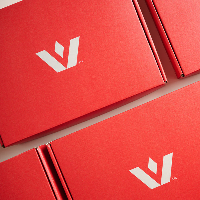 Red gift boxes with white logos