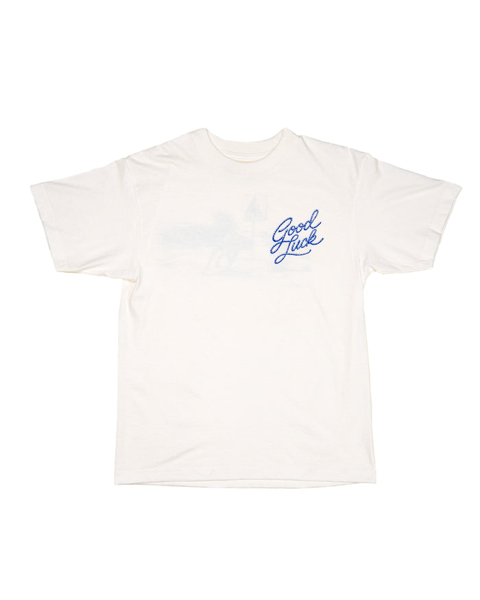 White t-shirt with Good Luck text in blue on a white background