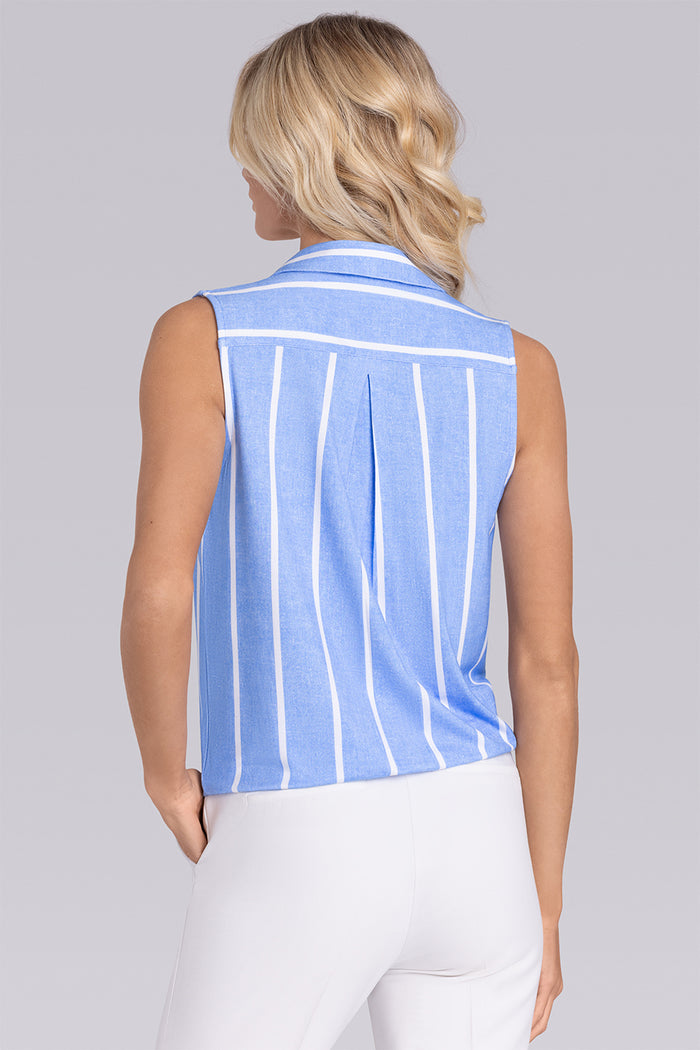 Model wearing Harmony Airy Blue Icy Bamboo® sleeveless v-neck shirt, styled with white pants.