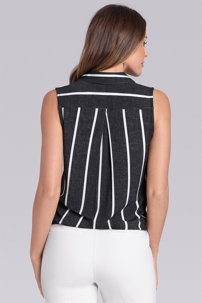 Model wearing Harmony Black White Icy Bamboo® sleeveless v-neck shirt, styled with white pants.