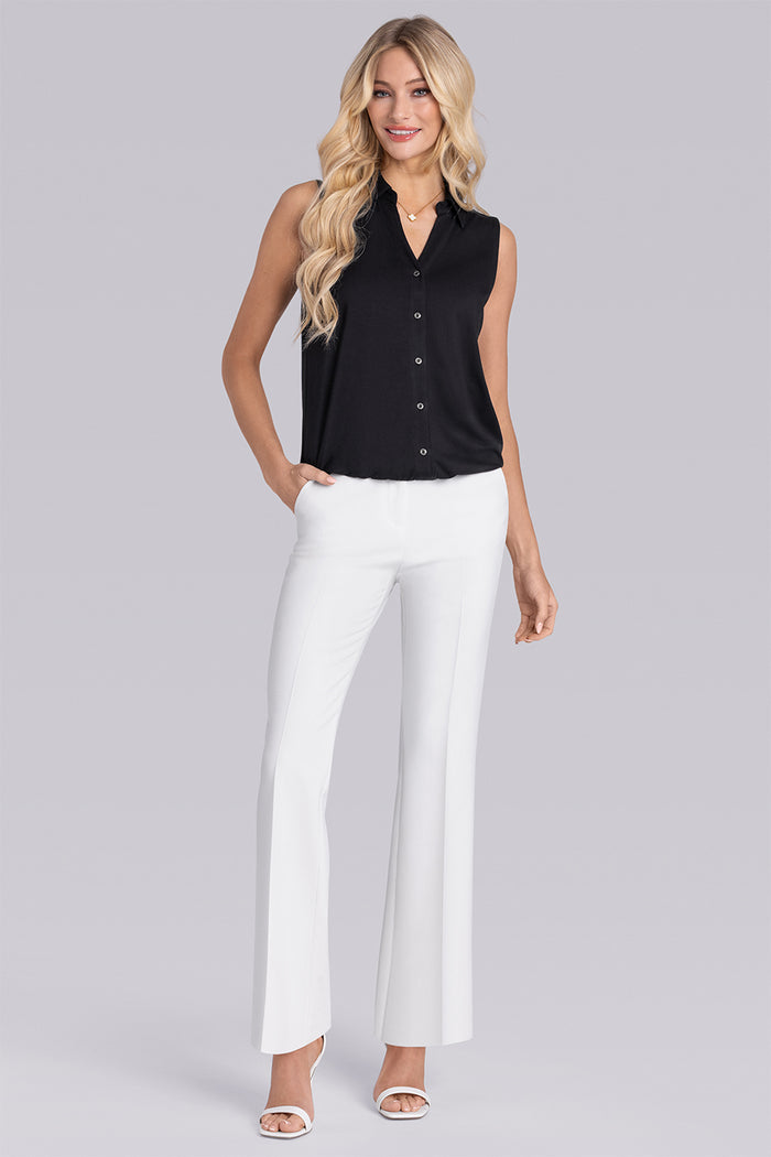 Model wearing Harmony Black Icy Bamboo® sleeveless v-neck shirt, styled with white pants.