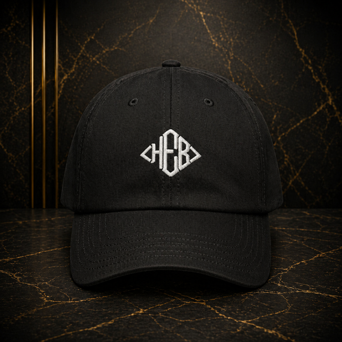 Hebrews — Magen Monogram™ — White Thread | Under Armour Embroidered Dad Hat (5 colors)