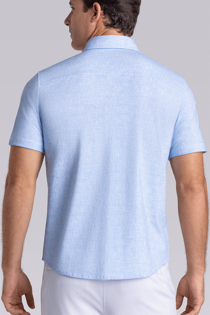Model wearing Horizon Haze Blue Icy Cotton® short sleeve shirt classic collar, styled with white shorts