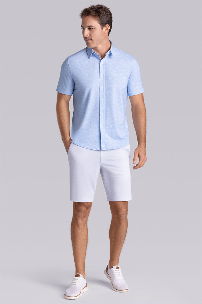 Model wearing Horizon Haze Blue Icy Cotton® short sleeve shirt classic collar, styled with white shorts