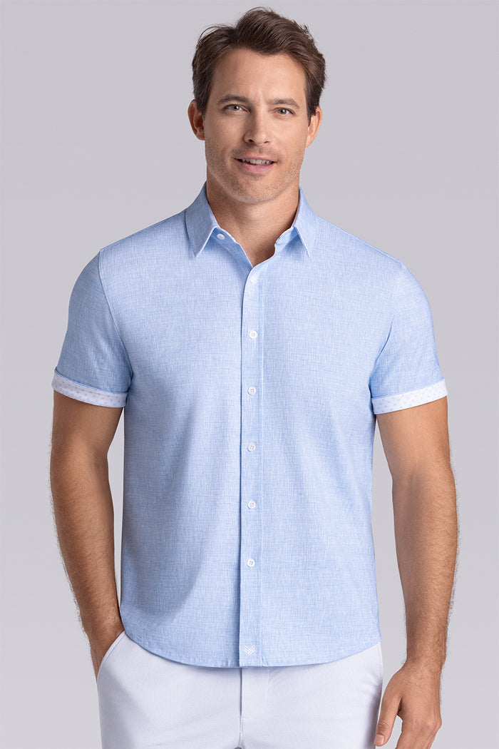 Model wearing Horizon Haze Blue Icy Cotton® short sleeve shirt classic collar, styled with white shorts