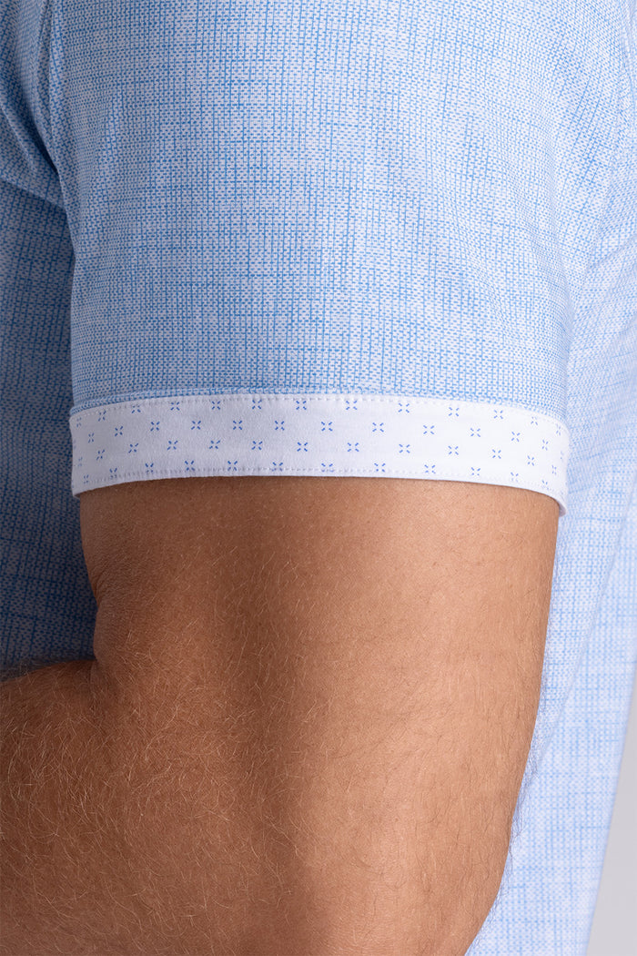 Model wearing Horizon Haze Blue Icy Cotton® short sleeve shirt classic collar, styled with white shorts
