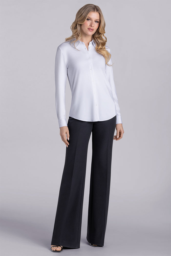 Model wearing Icon White Icy Bamboo® long sleeve classic collar shirt, styled with black pants.