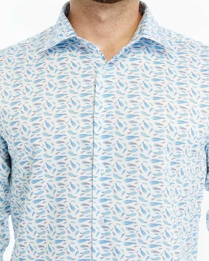 Close-up of a patterned shirt with blue and gray designs on a white background