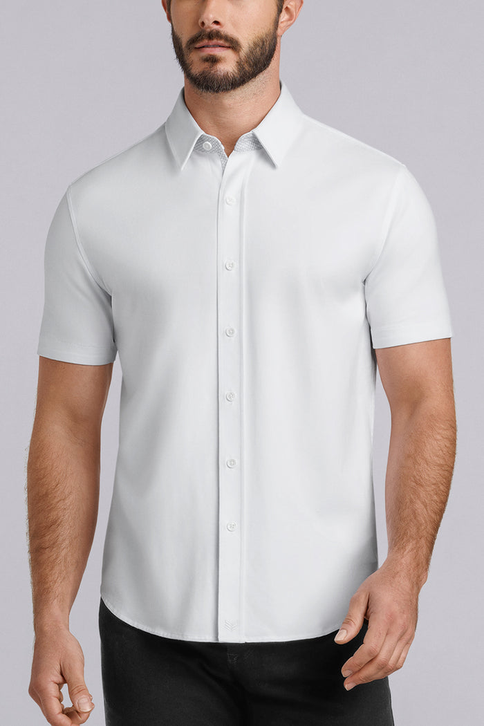 Model wearing Iconic Rapport White short sleeve classic collar shirt, styled with black pants