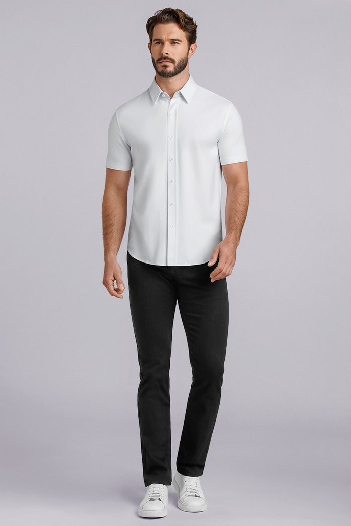 Model wearing Iconic Rapport White short sleeve classic collar shirt, styled with black pants