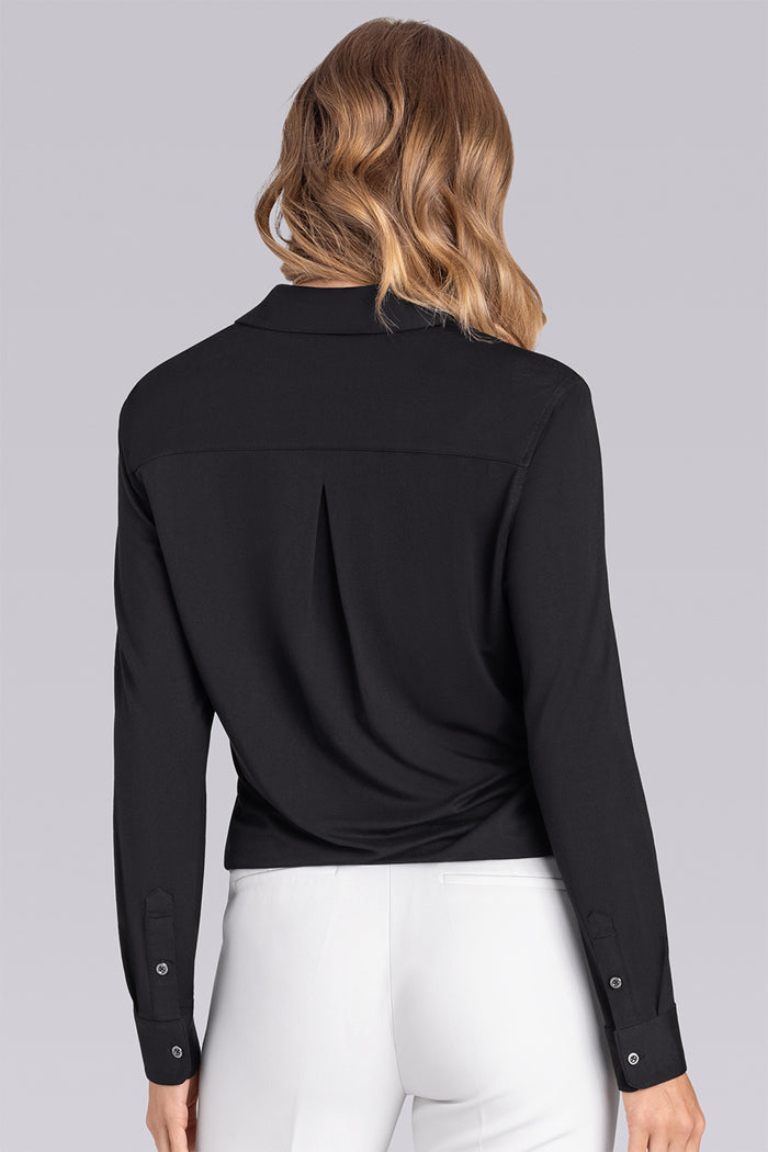 Model wearing Idol Black Icy Bamboo® long sleeve classic collar shirt, styled with white pants.