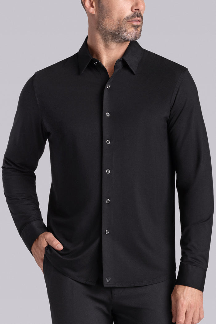Model wearing Illustrious Black Icy Bamboo® long sleeve dress shirt, styled with black pants