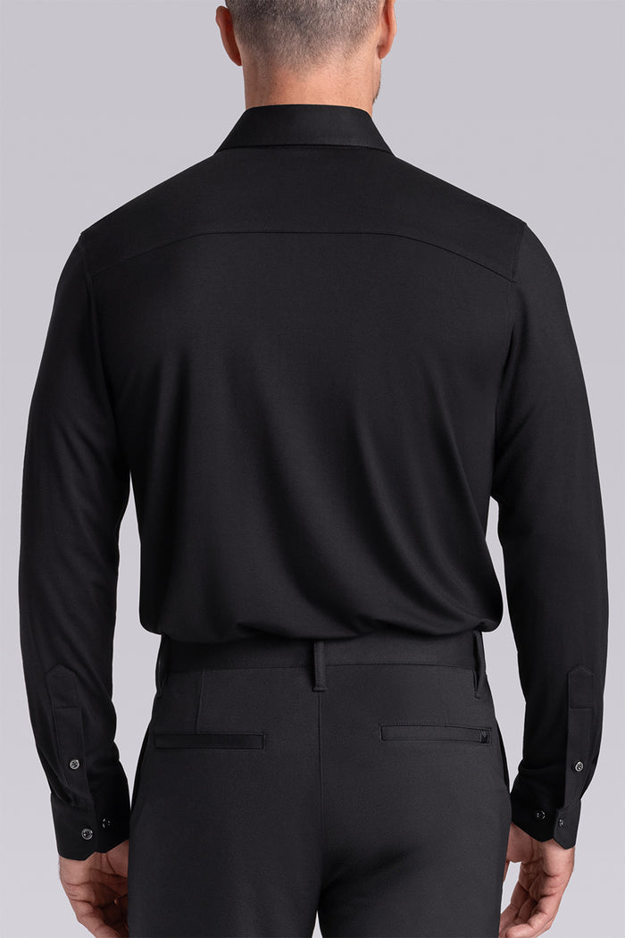 Model wearing Illustrious Black Icy Bamboo® long sleeve dress shirt, styled with black pants