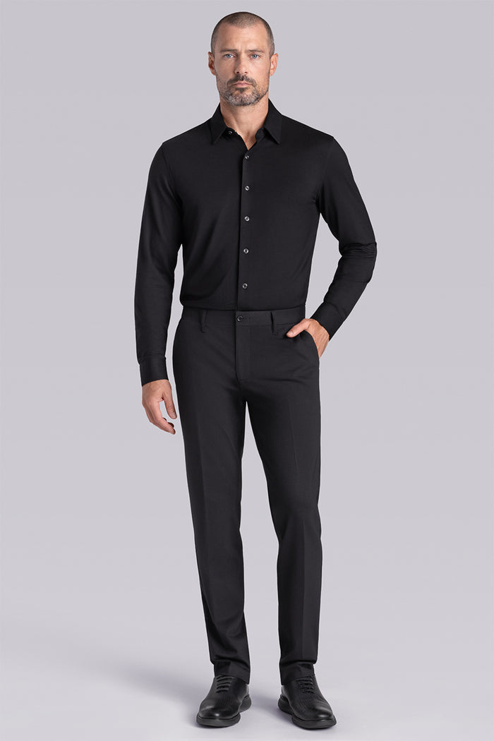 Model wearing Illustrious Black Icy Bamboo® long sleeve dress shirt, styled with black pants