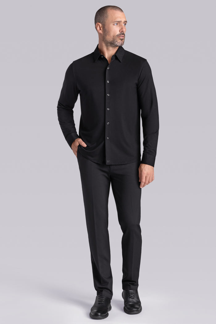 Model wearing Illustrious Black Icy Bamboo® long sleeve dress shirt, styled with black pants