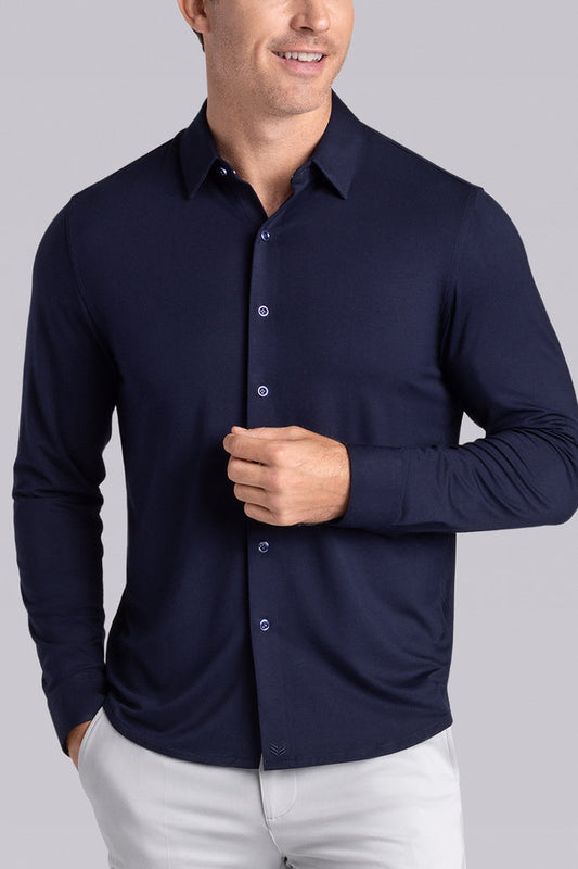 Model wearing Illustrious Monaco Blue Icy Bamboo® long sleeve dress shirt, styled with white pants