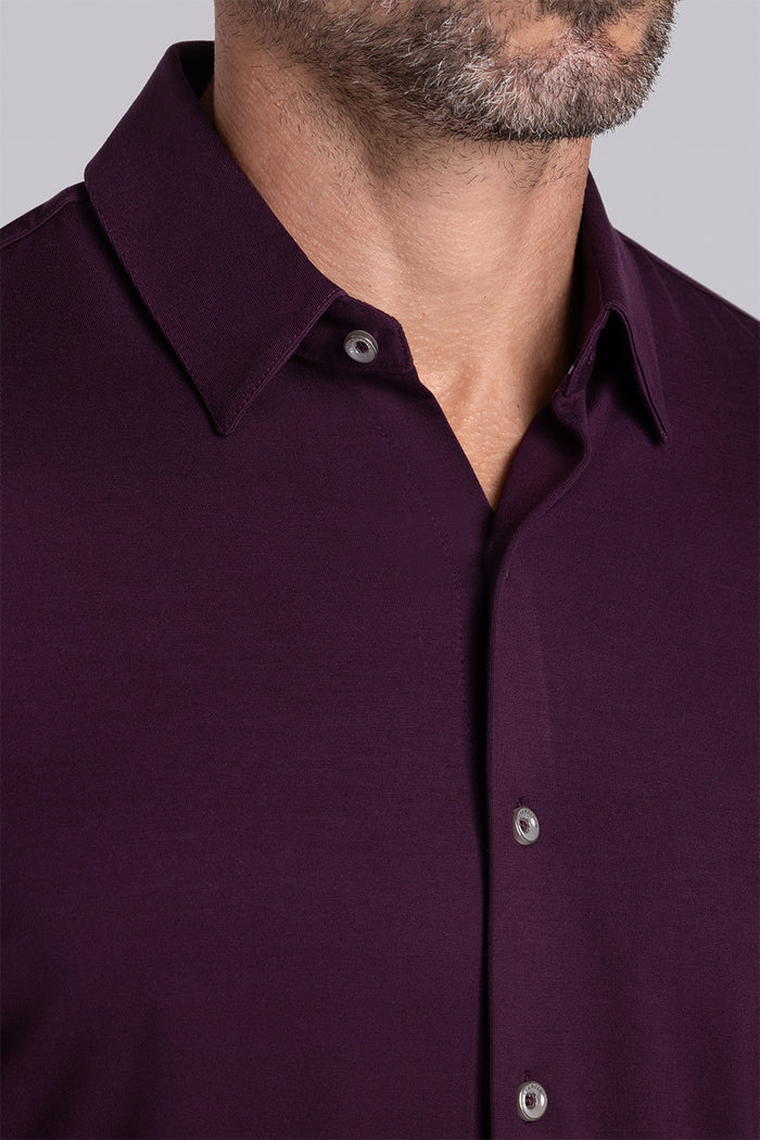 Model wearing Illustrious Plum Icy Bamboo® long sleeve dress shirt styled with black pants
