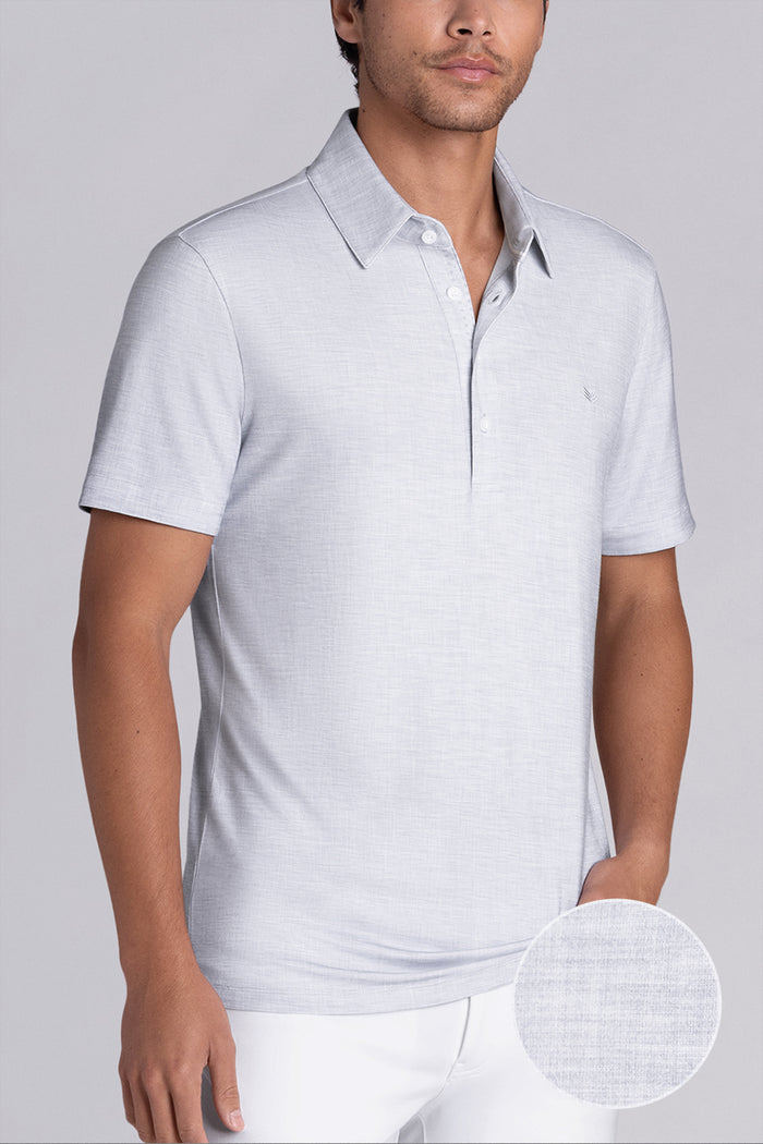 Model wearing Immaculate Light Grey short sleeve polo, styled with white pants