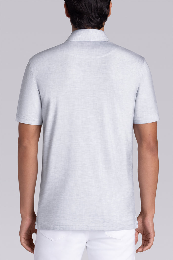 Model wearing Immaculate Light Grey short sleeve polo, styled with white pants
