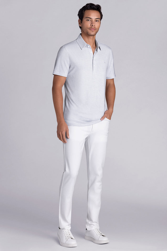 Model wearing Immaculate Light Grey short sleeve polo, styled with white pants