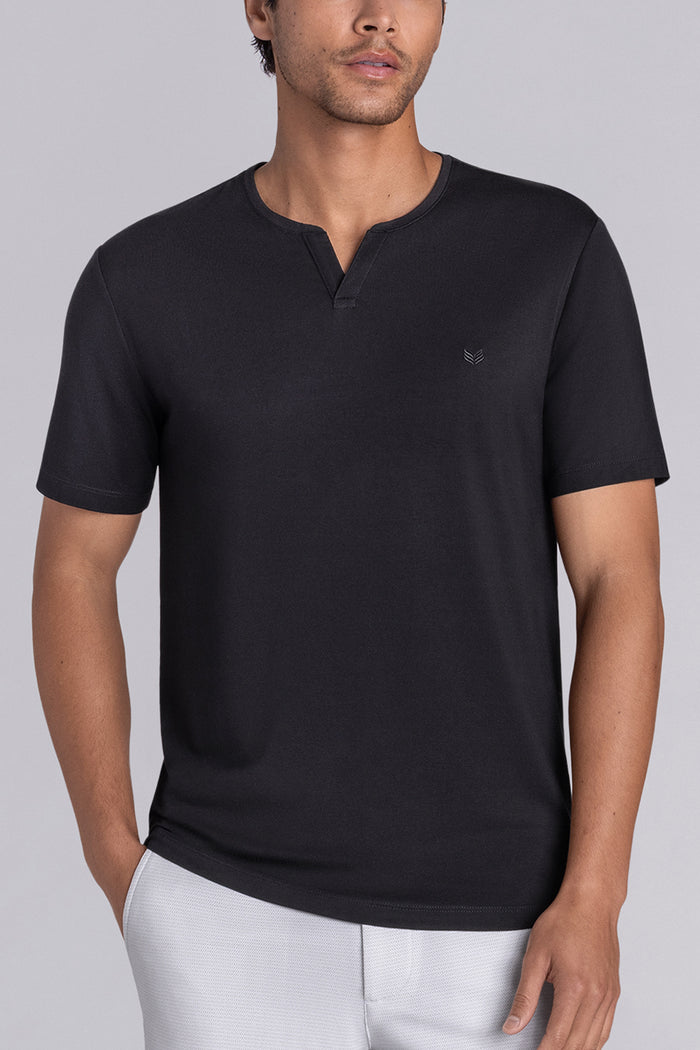 Model wear Infallible in Black short sleeve shirt, styled white shorts