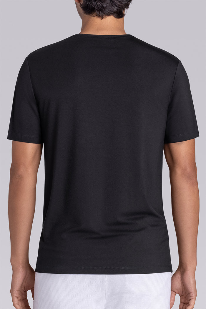 Model wear Infallible in Black short sleeve shirt, styled white shorts