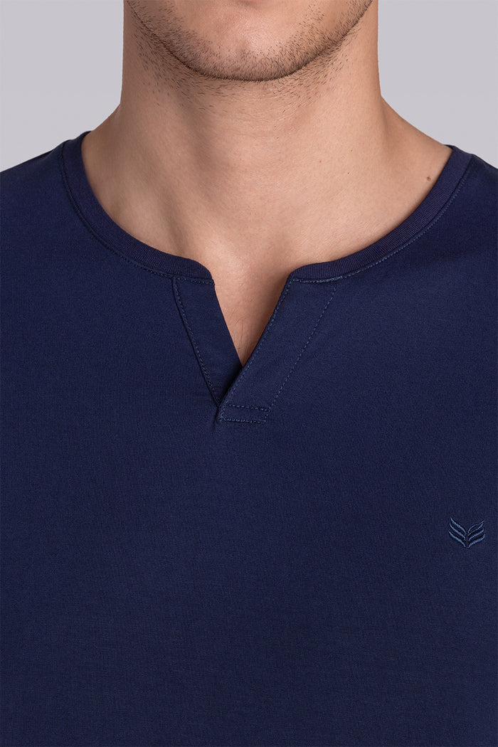 Model wear Infallible in Navy short sleeve shirt, styled white shorts