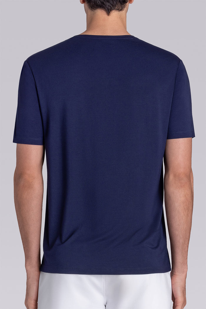 Model wear Infallible in Navy short sleeve shirt, styled white shorts