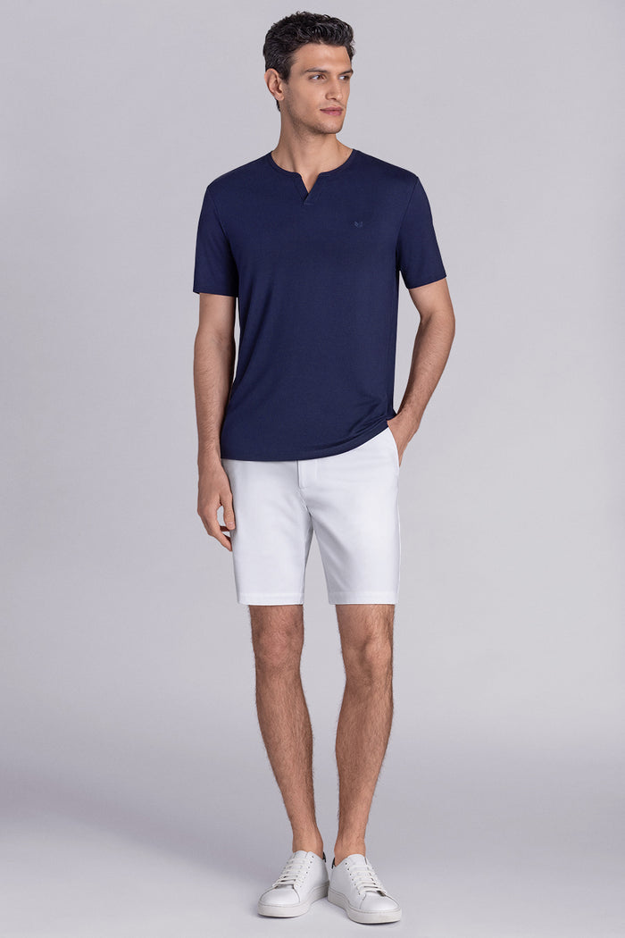 Model wear Infallible in Navy short sleeve shirt, styled white shorts