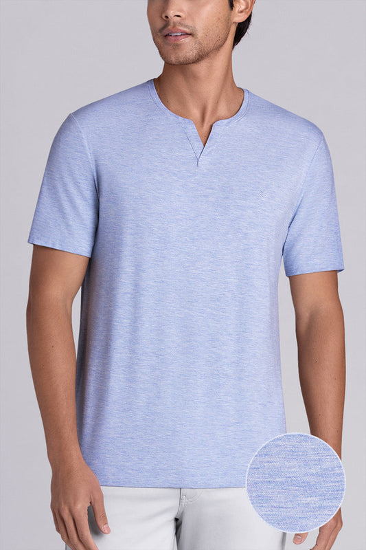 Model wear Infallible in Sky Blue Heather short sleeve shirt, styled white pants
