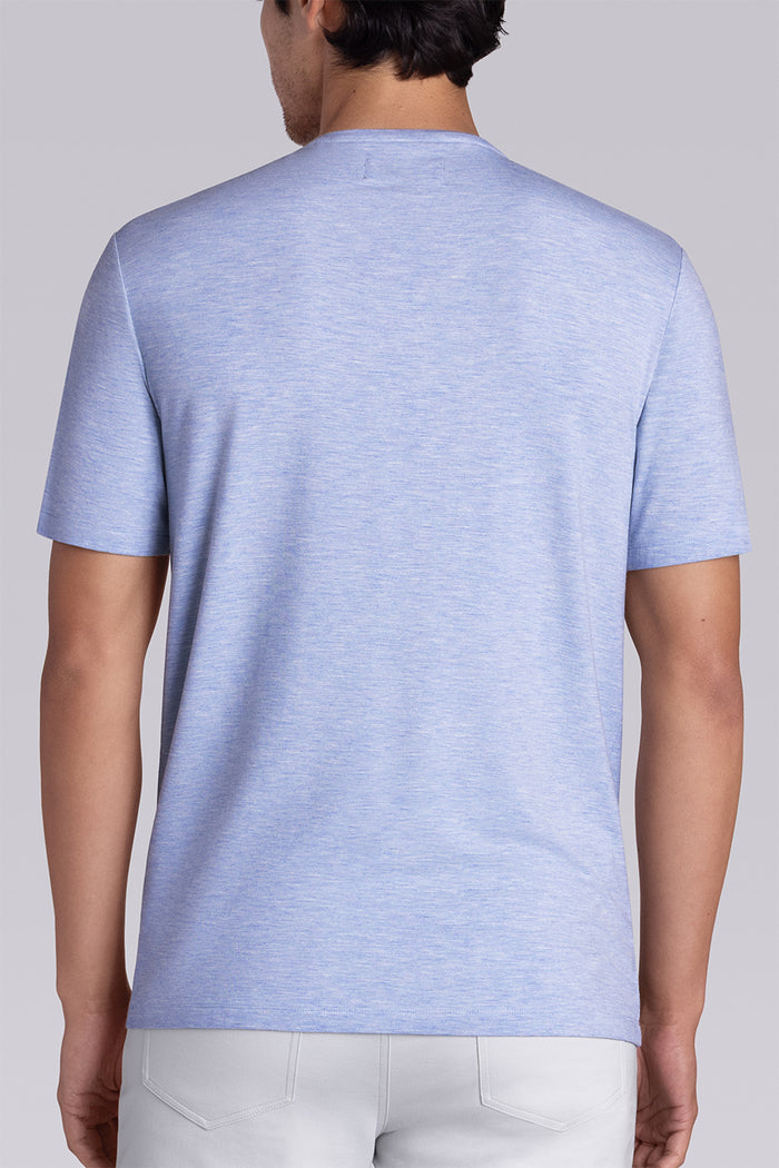 Model wear Infallible in Sky Blue Heather short sleeve shirt, styled white pants