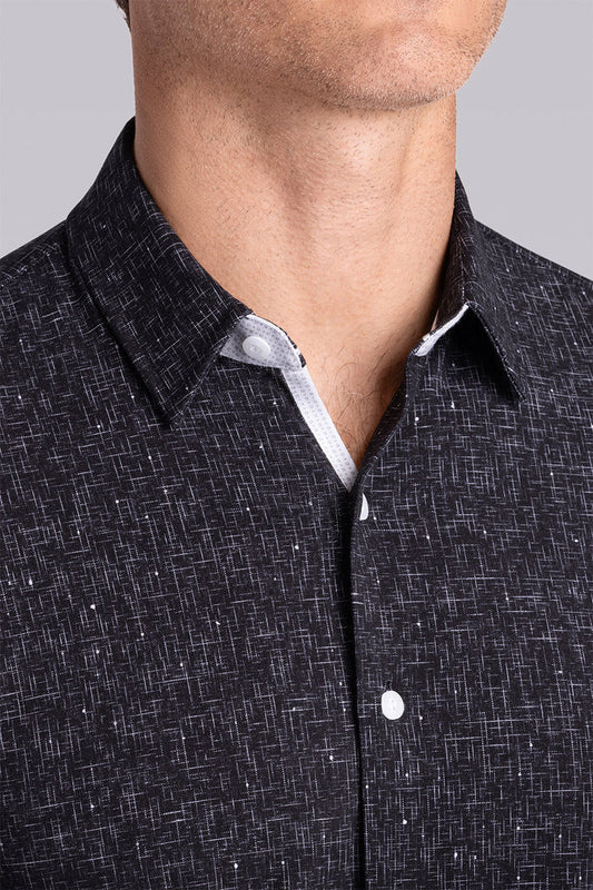 Model wear Integrity Black Icy Cotton® long sleeve classic collar shirt, styled with white pants.