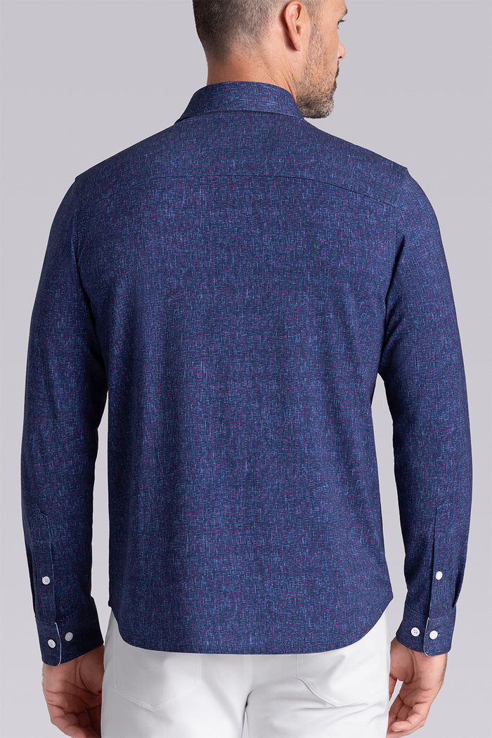 Model wear Integrity Navy Icy Cotton® long sleeve classic collar shirt, styled with white pants.