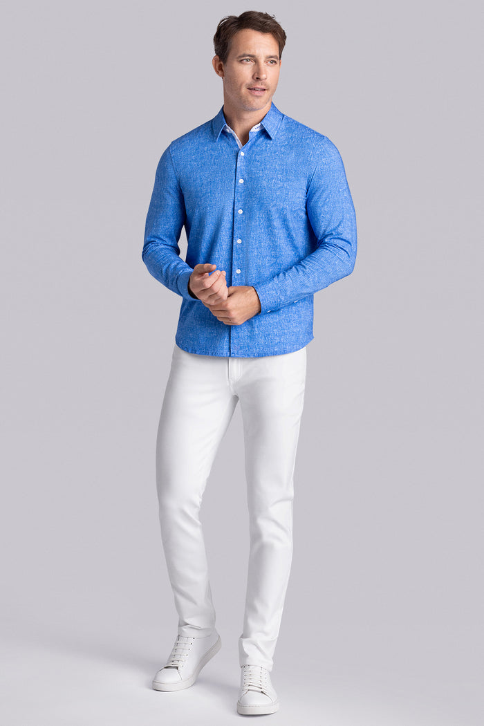 Model wear Integrity Ocean Blue Icy Cotton® long sleeve classic collar shirt, styled with white pants.