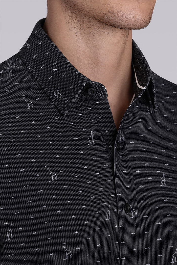 Model wear Intrepid Black short sleeve print shirt, styled with white shorts.