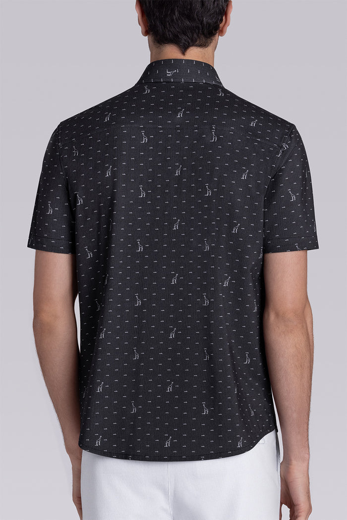 Model wear Intrepid Black short sleeve print shirt, styled with white shorts.